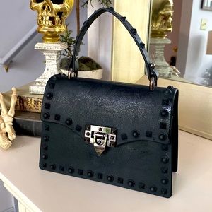 Small black rubber handbag